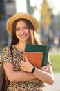 Young female student with backpack and books. Royalty Free Stock Photo