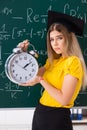 The young female student in front of the chalkboard Royalty Free Stock Photo