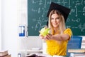 The young female student in front of the chalkboard Royalty Free Stock Photo