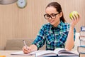 The young female student preparing for exams Royalty Free Stock Photo