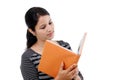 Young female student reading a text book Royalty Free Stock Photo