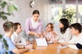 Young female student taking part in group discussion with coursemates Royalty Free Stock Photo