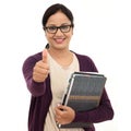 Young female student with thumbs up gesture Royalty Free Stock Photo