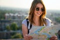 Young woman, student traveler with backpack enjoying summer vacation.