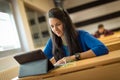 Young female student at university classroom.