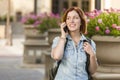 Young Female Student Walking Outside Using Cell Phone Royalty Free Stock Photo