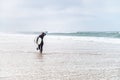 Young female surfer wearing wetsuit Royalty Free Stock Photo