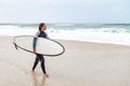 Young female surfer wearing wetsuit Royalty Free Stock Photo