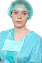 Young female surgeon doctor standing with arms crossed and smiling, Isolated over white background Royalty Free Stock Photo