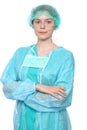 Young female surgeon doctor standing with arms crossed and smiling,  over white background Royalty Free Stock Photo