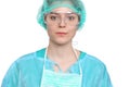 Young female surgeon doctor standing with arms crossed and smiling,  over white background Royalty Free Stock Photo