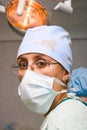 Young female surgeon with mask in operation room Royalty Free Stock Photo