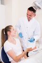Young female is takking advice from dentist Royalty Free Stock Photo