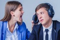 Young female team leader aggressive attacks male employee working in office Royalty Free Stock Photo