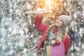 Young female teen customer with Christmas gifts