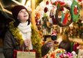 Young female teen customer with Christmas gifts