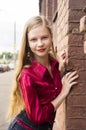 Young female teen girl pose against a brick wall. Royalty Free Stock Photo