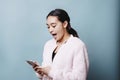 Female Teen Shocked While Looking at Cell Phone Royalty Free Stock Photo