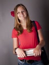 Young female teenage student carrying books Royalty Free Stock Photo