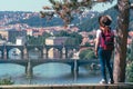 Young female tourist in a cowboy hat with sunglasses and a backpack, enjoying great view on the old town of Prague. Praha, Travel Royalty Free Stock Photo