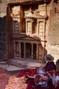 Young female tourist enjoying the beautiful view of ancient Petra Wadi Jordan