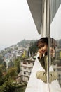 A young female tourist enjoying the view of beautiful Gangtok the capital city of Sikkim