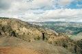 Young female tourist enjoying the view into Waimea Canyon, Kauai, Hawaii Royalty Free Stock Photo