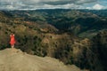 Young female tourist enjoying the view into Waimea Canyon, Kauai, Hawaii Royalty Free Stock Photo