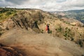 Young female tourist enjoying the view into Waimea Canyon, Kauai, Hawaii Royalty Free Stock Photo