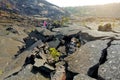 Young female tourist exploring surface of the Kilauea Iki volcano crater with crumbling lava rock in Volcanoes National Park in Bi Royalty Free Stock Photo