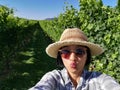 Selfie woman travel in vinyards, Okanagan valley, British Columbia Canada