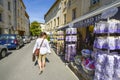 Young female tourist walks past a lavender shop in Avignon France, Provence