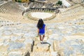 Young female traveler in back. Famous The Great Theatre in Ephesus. Travel concept
