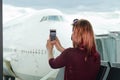 young female traveler, Blogger in airport lounge near windows happy smile taking selfie photo flight