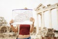 Young female traveler with map enjoying the view antalya from.Traveling in turkey