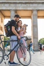 young female traveler showing photo camera to boyfriend