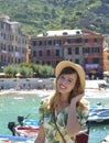 Portrait of young woman, harbor of Vernazza, Cinque Terre, Italy. Royalty Free Stock Photo