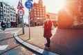 Young female traveller standing in empty Amsterdam downtown without people. Netherlands coronavirus covid-19 outbreak Royalty Free Stock Photo