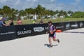 Young female triathlete finishing the running segment of 2019 South Beach Triathlon.