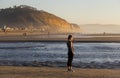 Young Female Using Mobile Electronic Device Outdoors on Torrey Pines State Beach