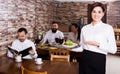Female waiter showing country restaurant Royalty Free Stock Photo