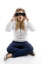 Young female watching into binoculars Royalty Free Stock Photo