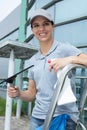 young female window cleaner smiling Royalty Free Stock Photo