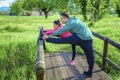 Young female workout before fitness training stretching session at the park. Healthy young adult man and woman outdoors. couple Royalty Free Stock Photo