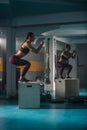 A young female doing a box jump in the gym Royalty Free Stock Photo