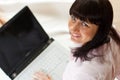 Young female works on her laptop