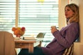 A young female writer drinking coffee and waiting for the inspiration at the kitchen. Writing, morning, inspiration Royalty Free Stock Photo