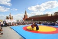 The young fighters are locked in Mongolian wrestling