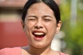 Young Filipina Woman With Eyes Closed Royalty Free Stock Photo