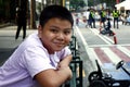 Young Filipino boy pose for the camera while at a business district Royalty Free Stock Photo